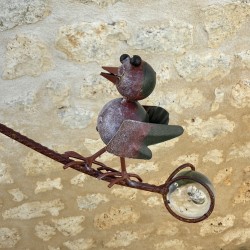 Metal Patinated Bird Mobile Viewed from the Glass Counterweight