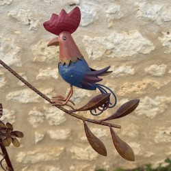 Decorative garden mobile featuring painted metal hens – view of the first hen
