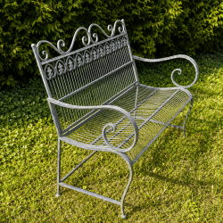 Perforated seat of a decorative metal outdoor bench