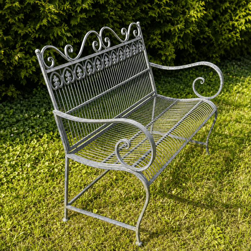 Perforated seat of a decorative metal outdoor bench