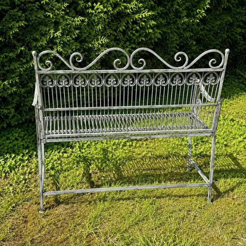 Antique garden bench in patinated verdigris metal, rear view