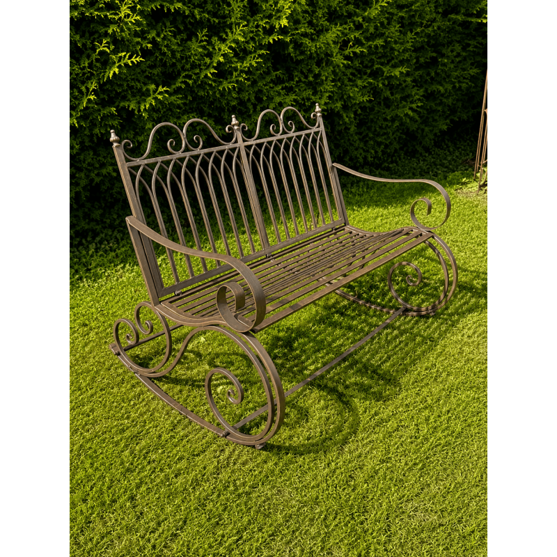 Wrought-iron rocking chair, side view, three-quarter view