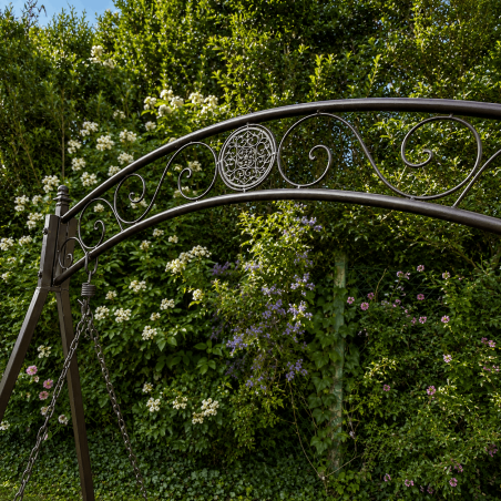 Brown two-seater garden swing with fold-down trays