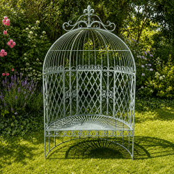 Patinated verdigris metal garden arch bench – A romantic seat for roses and clematis
