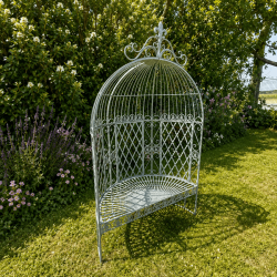 Patinated verdigris metal garden arbor bench, three-quarter view