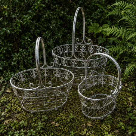 Oval aged gray metal pot holder with fleur-de-lis – front view of the 3 baskets
