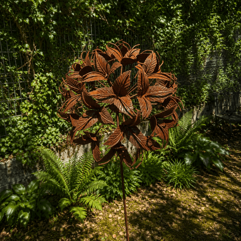 Rust-colored metal flower on a stake