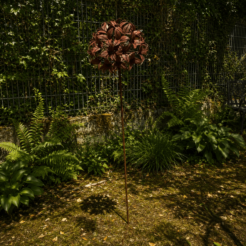 Rust-colored metal flower on a stake – overview