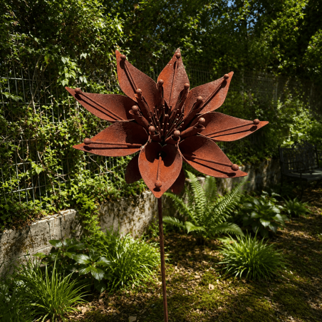 Rusty metal star flower on a stake