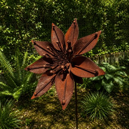Rusty metal star flower on a stake