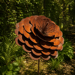 Rust-colored metal rose on a stake