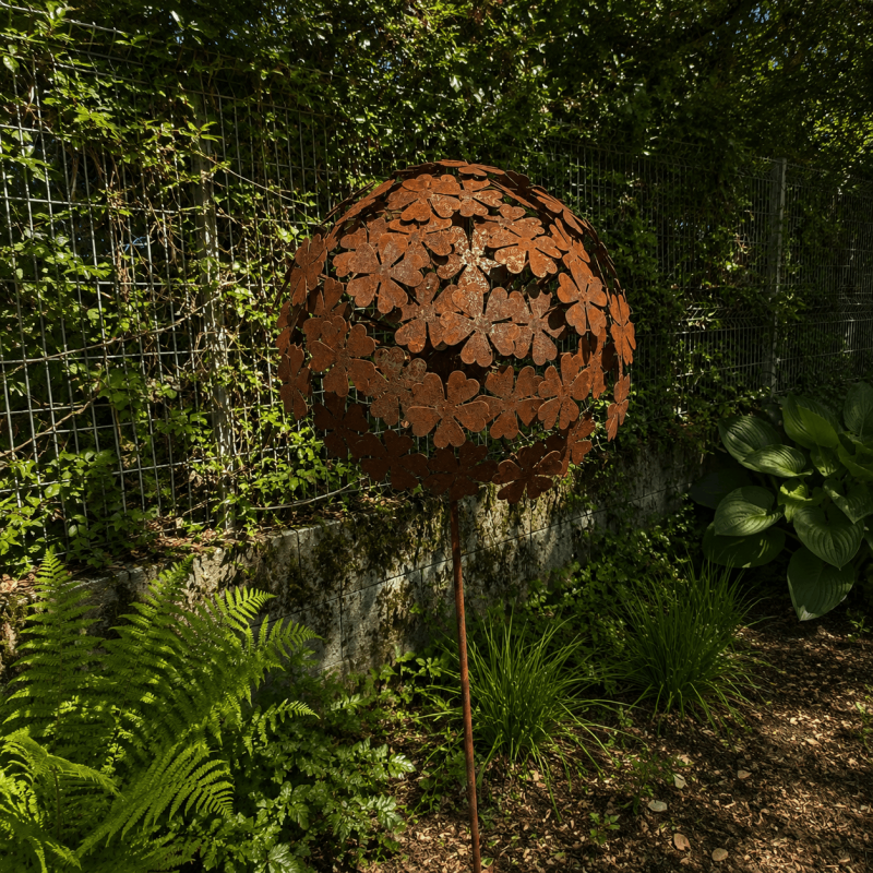 Rust-colored metal allium on a stake