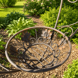 Romantic hanging planter with decorative flowers and scrollwork