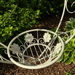 Romantic hanging planter with decorative flowers and scrollwork
