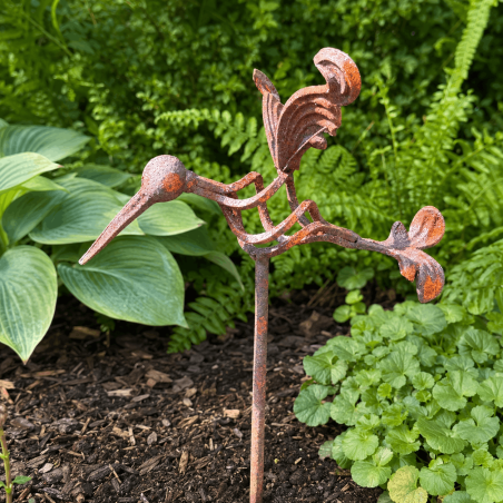Long-beaked metal bird with outstretched wings for the garden