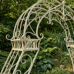 Detail of the arabesques and the aged ivory finish of the arch
